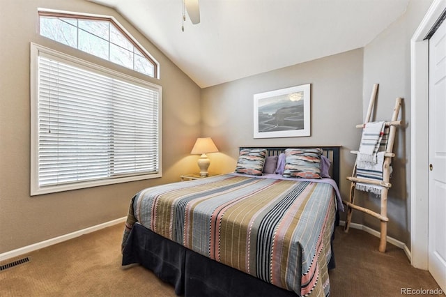 carpeted bedroom featuring lofted ceiling, ceiling fan, visible vents, and baseboards