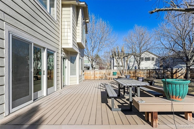 wooden deck with fence private yard and outdoor dining area