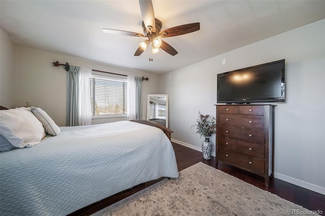 bedroom featuring ceiling fan and dark hardwood / wood-style flooring