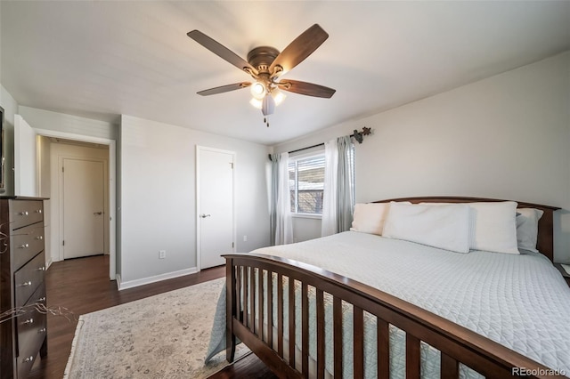 bedroom with ceiling fan and dark hardwood / wood-style flooring