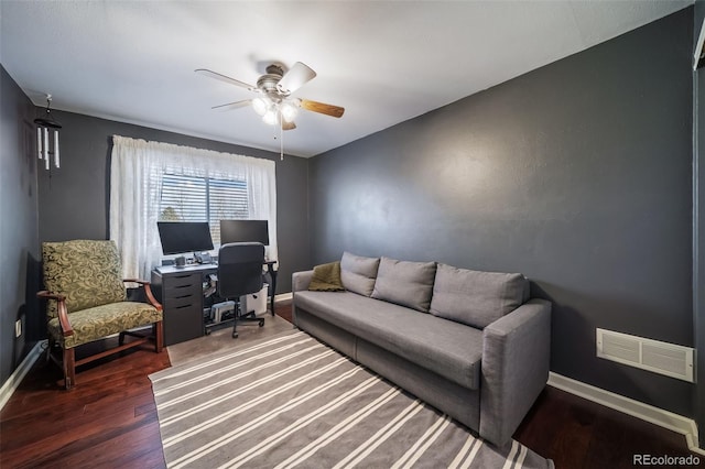 office area with ceiling fan and dark hardwood / wood-style flooring