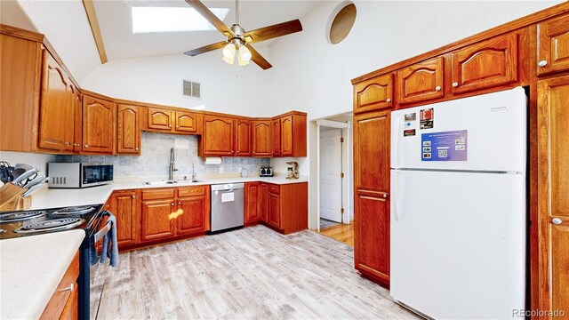 11348 Ranch Elsie Rd, Golden, CO 80403 - kitchen featuring light wood finished floors, ceiling fan, visible vents, a sink, and stainless steel appliances