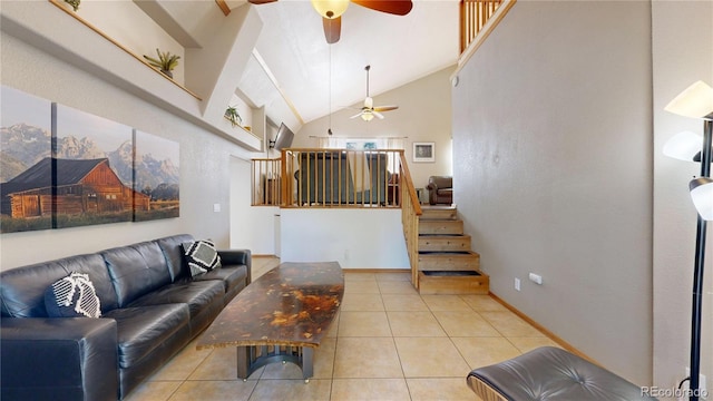 11348 Ranch Elsie Rd, Golden, CO 80403 - living room featuring stairway, tile patterned floors, ceiling fan, and high vaulted ceiling