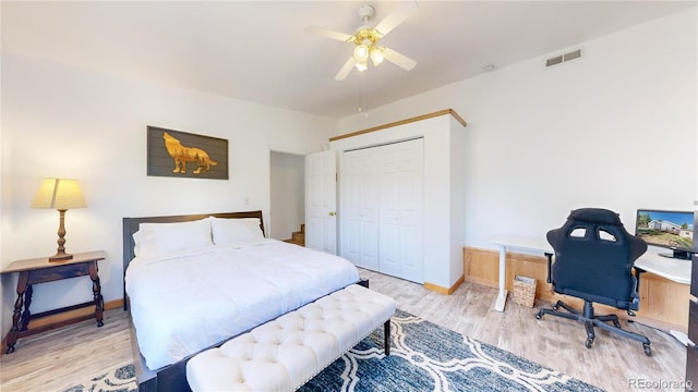 11348 Ranch Elsie Rd, Golden, CO 80403 - bedroom featuring a closet, baseboards, ceiling fan, visible vents, and wood finished floors
