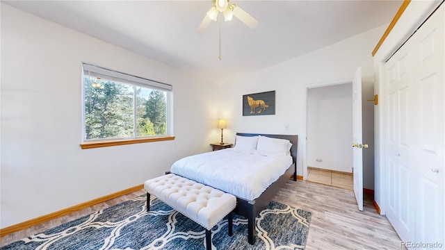 11348 Ranch Elsie Rd, Golden, CO 80403 - bedroom featuring baseboards, a closet, light wood-style flooring, and ceiling fan