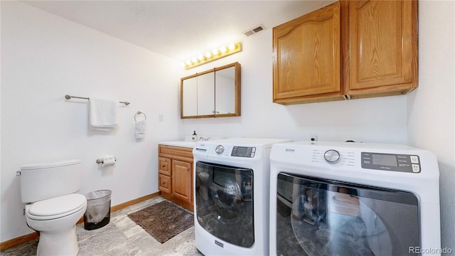 11348 Ranch Elsie Rd, Golden, CO 80403 - laundry room featuring baseboards, laundry area, washing machine and dryer, and visible vents