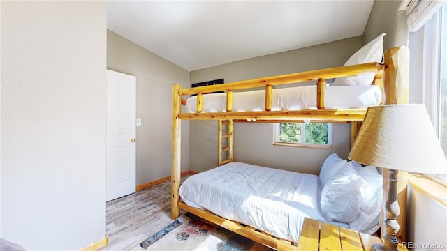 11348 Ranch Elsie Rd, Golden, CO 80403 - bedroom featuring baseboards and wood finished floors