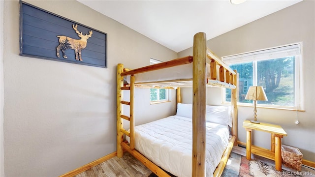 11348 Ranch Elsie Rd, Golden, CO 80403 - bedroom featuring wood finished floors and baseboards