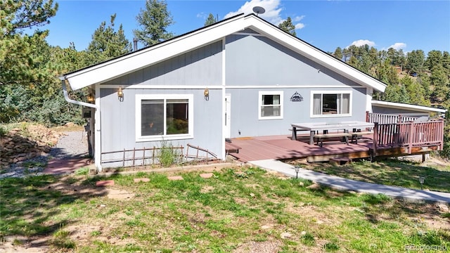 11348 Ranch Elsie Rd, Golden, CO 80403 - rear view of house with a lawn and a wooden deck