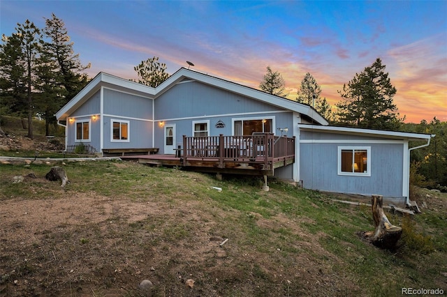 11348 Ranch Elsie Rd, Golden, CO 80403 - back of property featuring a wooden deck and a lawn