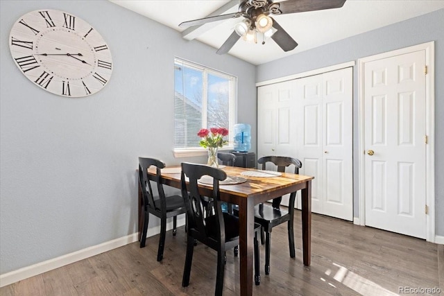 dining area with hardwood / wood-style floors and ceiling fan