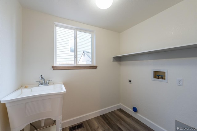 laundry area with washer hookup, electric dryer hookup, sink, and dark wood-type flooring