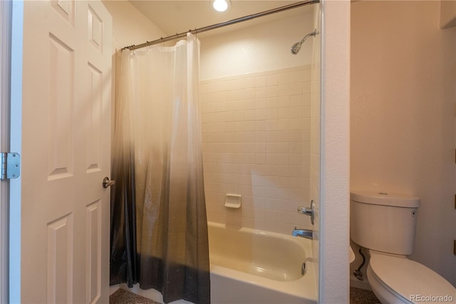 bathroom with shower / tub combo and toilet