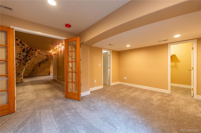 basement with carpet flooring and french doors