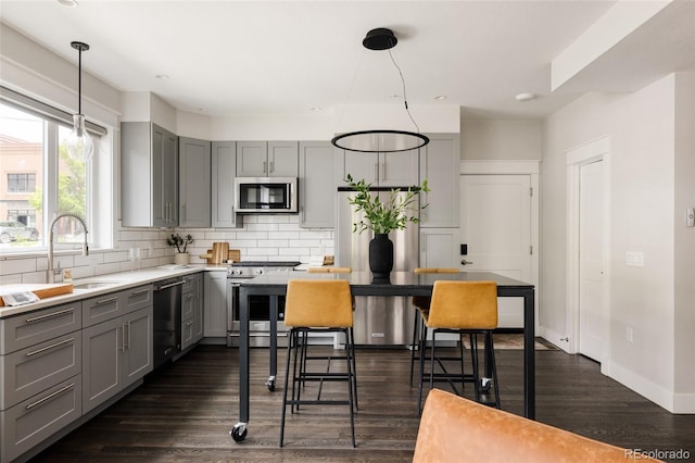 801 8th St, Golden, CO 80401 - kitchen featuring gray cabinets, stainless steel appliances, a sink, decorative backsplash, and recessed lighting