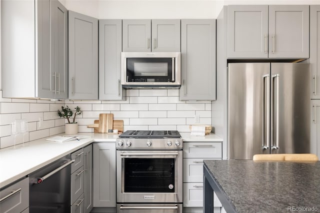 801 8th St, Golden, CO 80401 - kitchen featuring stainless steel appliances, gray cabinets, and tasteful backsplash