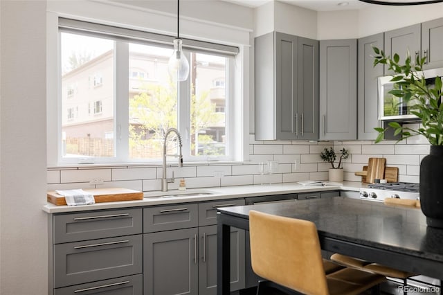 801 8th St, Golden, CO 80401 - kitchen with gray cabinetry, a sink, and tasteful backsplash