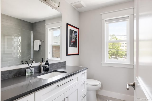 801 8th St, Golden, CO 80401 - full bathroom featuring vanity, toilet, tile patterned floors, baseboards, and a tile shower