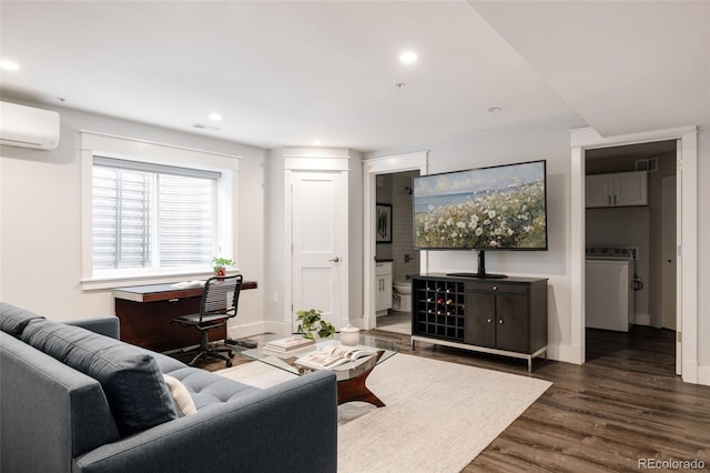 801 8th St, Golden, CO 80401 - living room with washer / dryer, dark wood-type flooring, an AC wall unit, recessed lighting, and baseboards