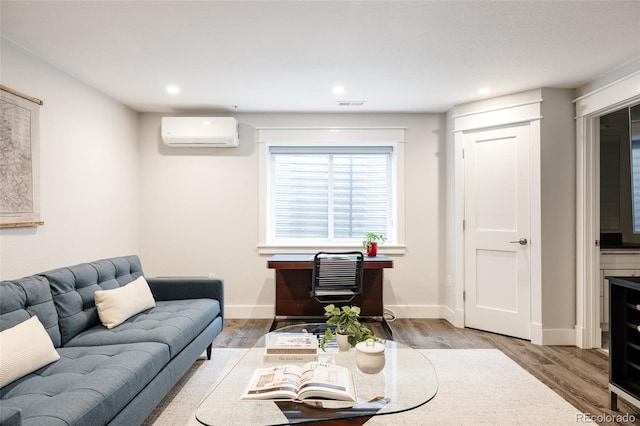 801 8th St, Golden, CO 80401 - living room featuring a wall unit AC, wood finished floors, recessed lighting, and baseboards