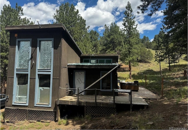 view of side of home with a deck