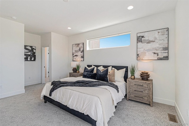 bedroom featuring light carpet