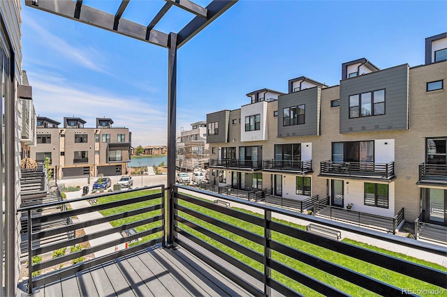 balcony featuring a water view