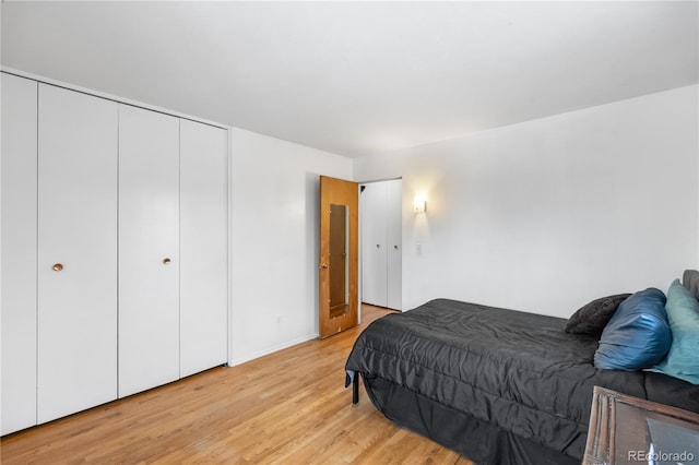 bedroom with light wood-type flooring