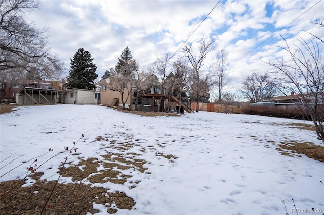 view of yard layered in snow