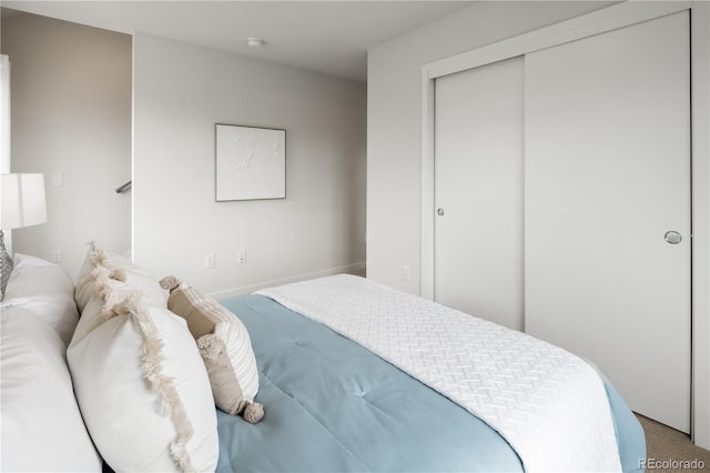 carpeted bedroom featuring a closet