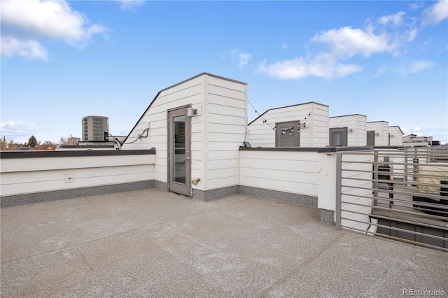 exterior space featuring central AC unit and fence