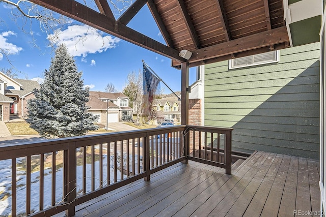 wooden deck featuring a residential view