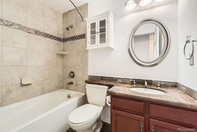 bathroom featuring vanity, toilet, and shower / washtub combination