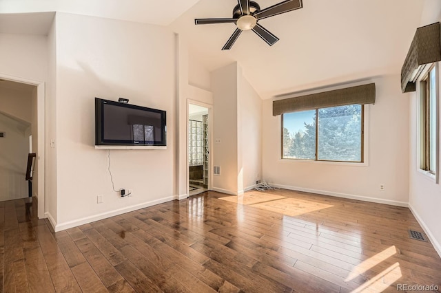 unfurnished living room featuring hardwood / wood-style floors, a ceiling fan, baseboards, visible vents, and vaulted ceiling