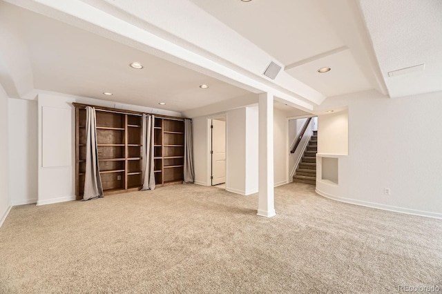 finished below grade area with stairway, recessed lighting, carpet, and baseboards