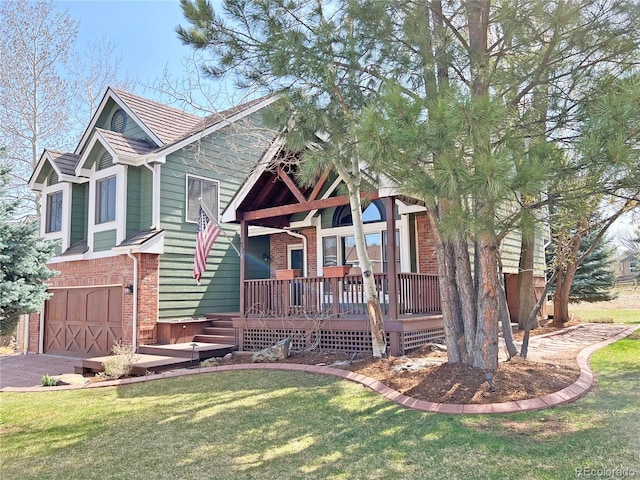 27 Buckthorn Dr, Littleton, CO 80127 - view of front of home featuring a garage, a front yard, brick siding, and a deck