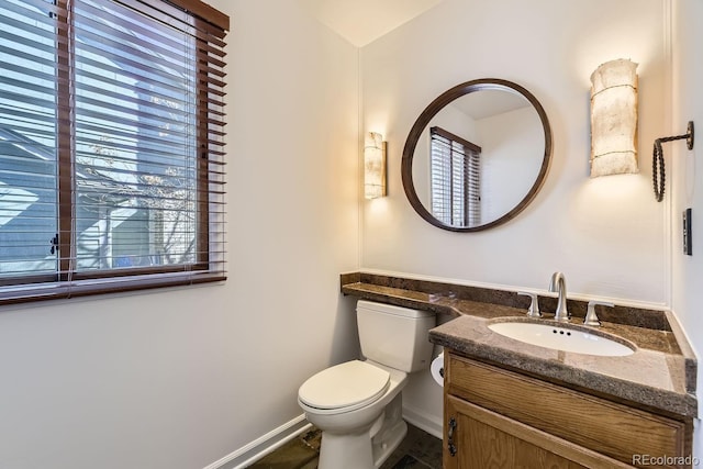 27 Buckthorn Dr, Littleton, CO 80127 - half bath with toilet, vanity, and baseboards