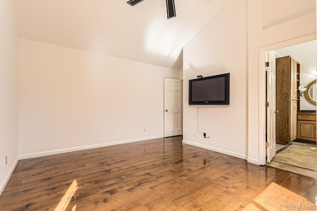 27 Buckthorn Dr, Littleton, CO 80127 - unfurnished living room with dark wood-style flooring, baseboards, high vaulted ceiling, and ceiling fan