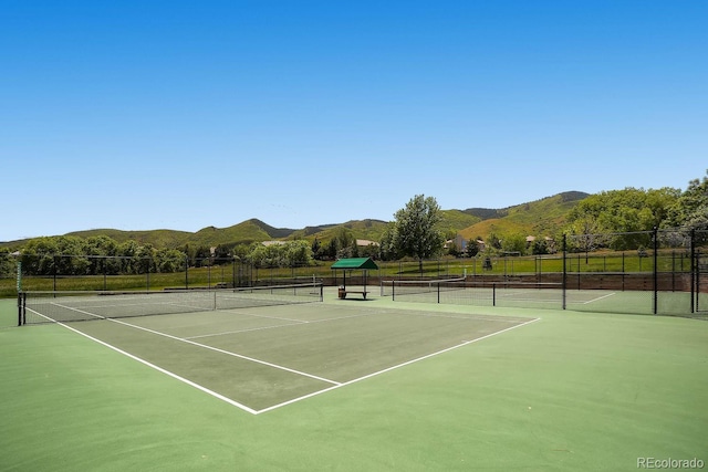 27 Buckthorn Dr, Littleton, CO 80127 - view of tennis court featuring a mountain view and fence