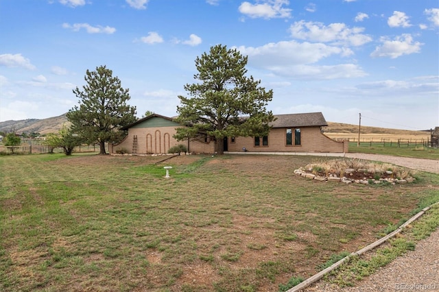 view of yard featuring a mountain view and a rural view