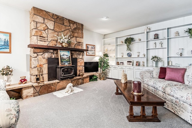 5300 Norwood Ave, Loveland, CO 80538 - carpeted living area featuring a wood stove