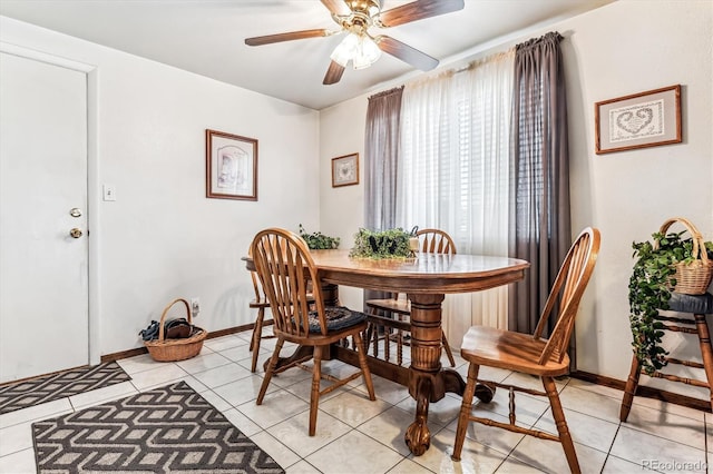 tiled dining area with ceiling fan