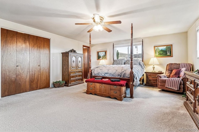 bedroom featuring ceiling fan and light colored carpet