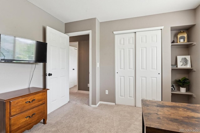 16662 W 61st Pl, Arvada, CO 80403 - bedroom with light colored carpet, a closet, and baseboards