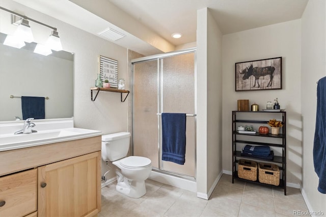 16662 W 61st Pl, Arvada, CO 80403 - full bath with vanity, toilet, tile patterned flooring, a stall shower, and baseboards