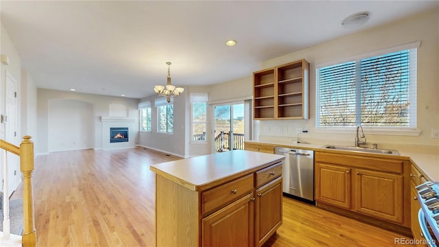 kitchen featuring open shelves, a sink, light wood finished floors, stove, and stainless steel dishwasher