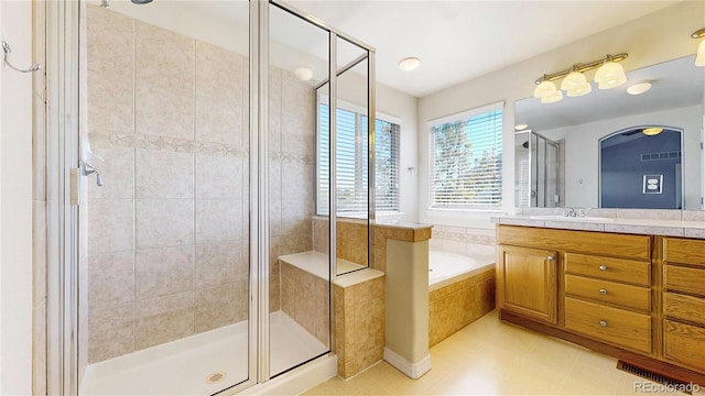 full bath featuring visible vents, a shower stall, a bath, and vanity