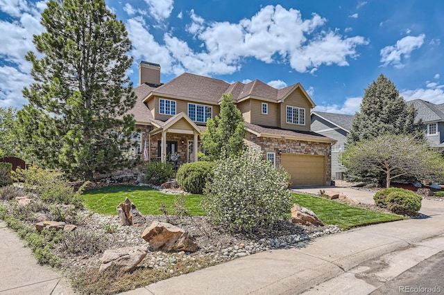 craftsman-style home with concrete driveway, stone siding, a chimney, and a front yard