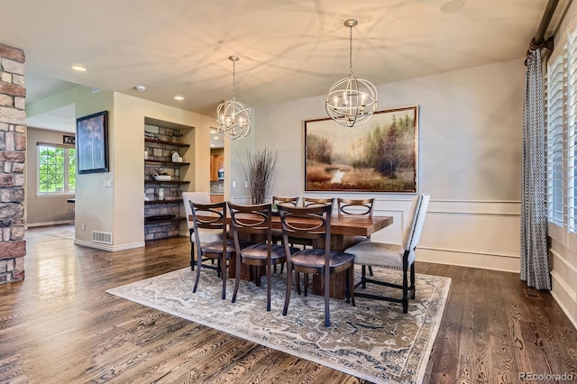dining room featuring wood finished floors, a chandelier, recessed lighting, and baseboards