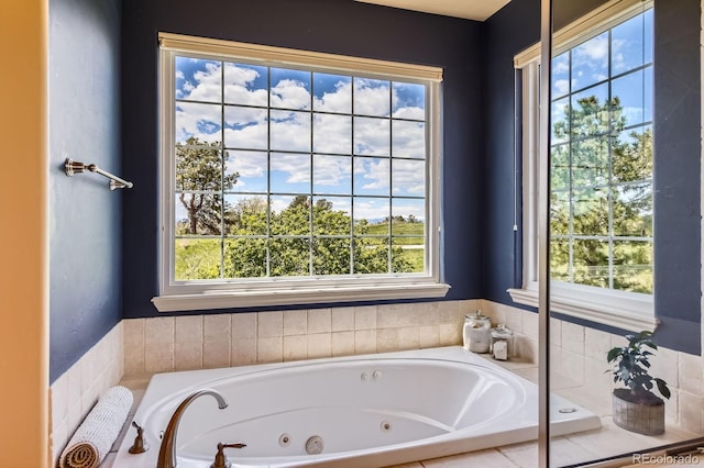 bathroom featuring plenty of natural light and a whirlpool tub